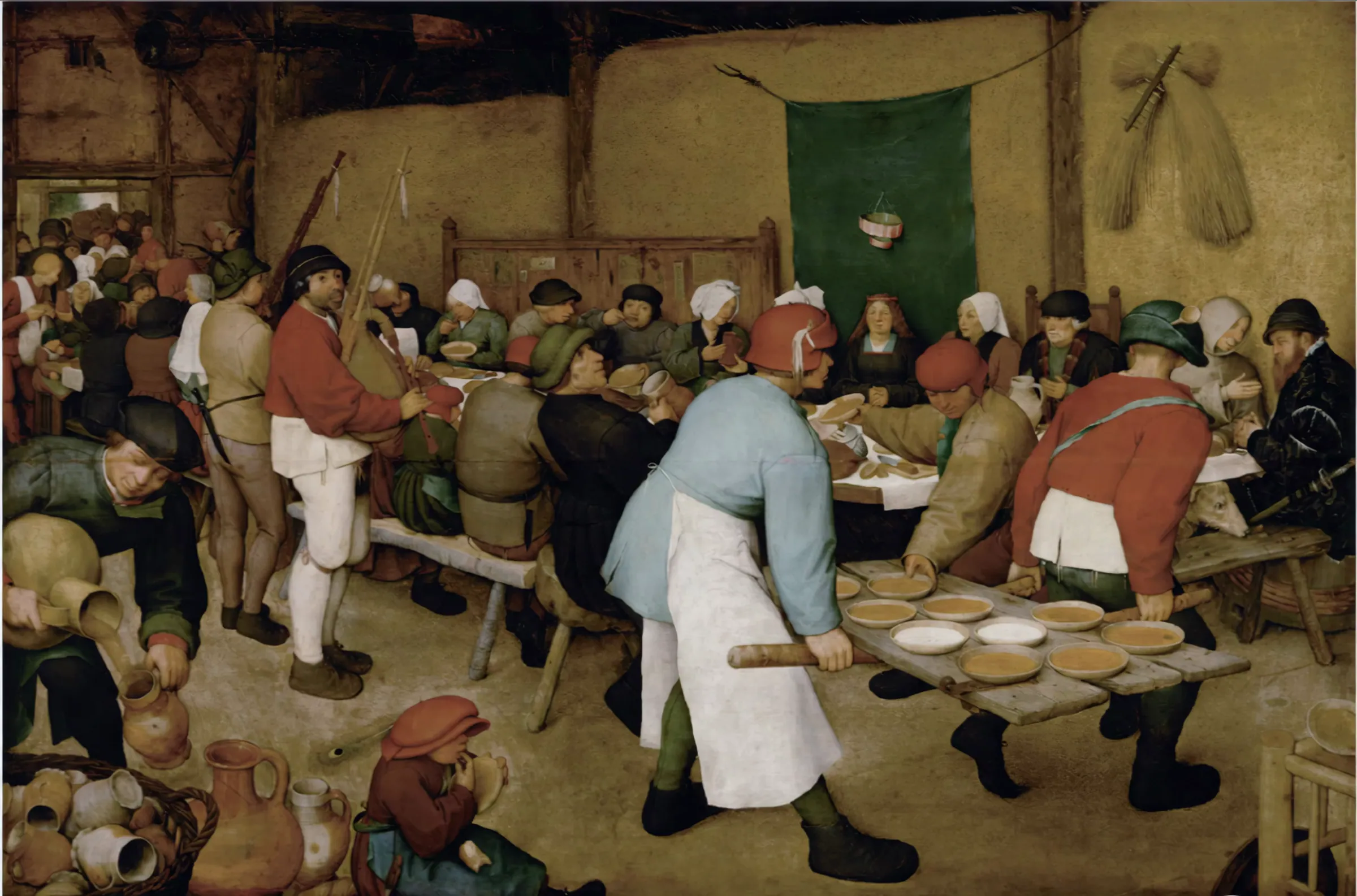 A detail of Pieter Bruegel the Elder’s The Peasant Wedding: guests at a long banquet table as a bowl of porridge is carried past.